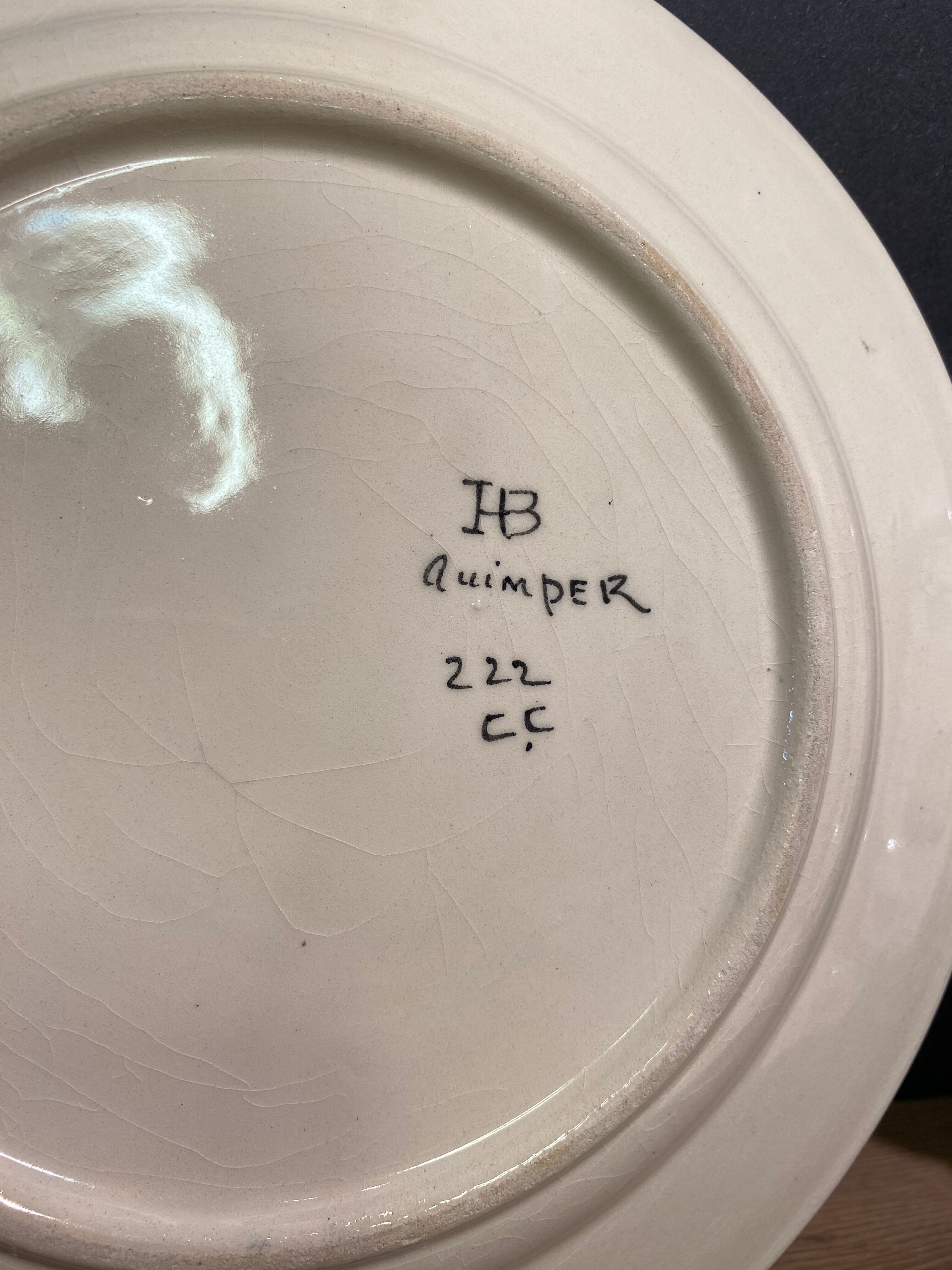Six earthenware plates signed HB Quimper