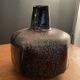 Black ceramic vase and galaxy, signed