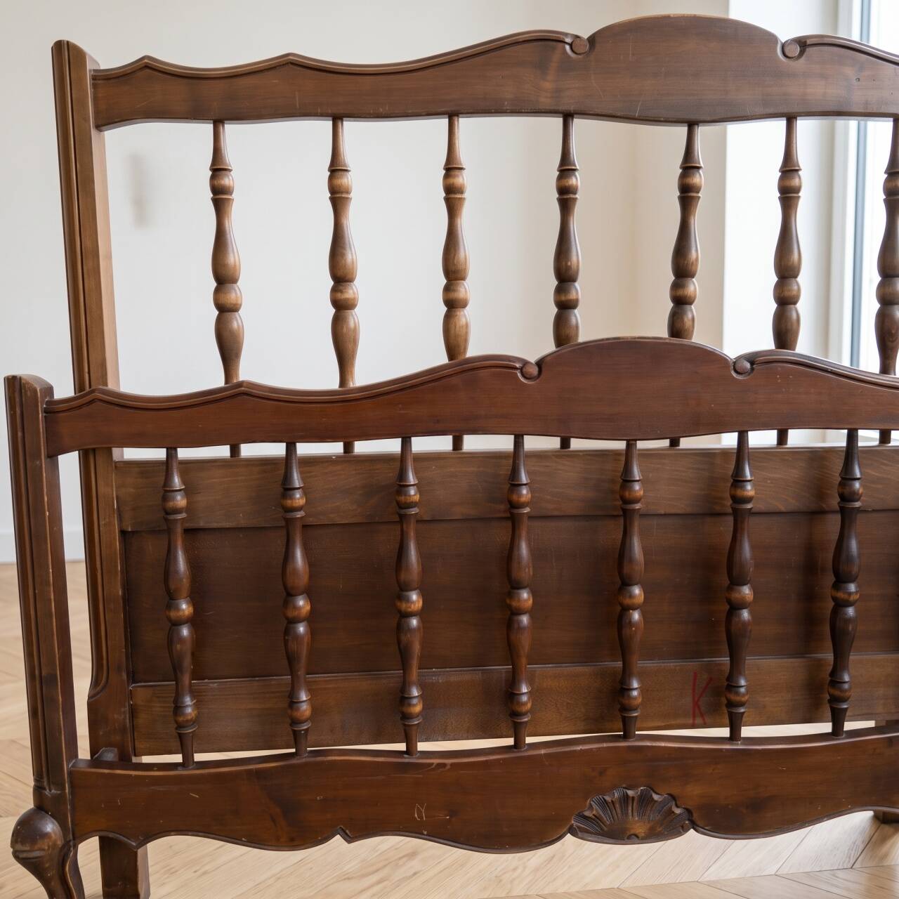 Double bed frame in antique Louis XV style made of solid wood.