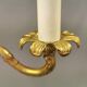 Older brass alloy chandelier with three light sources.