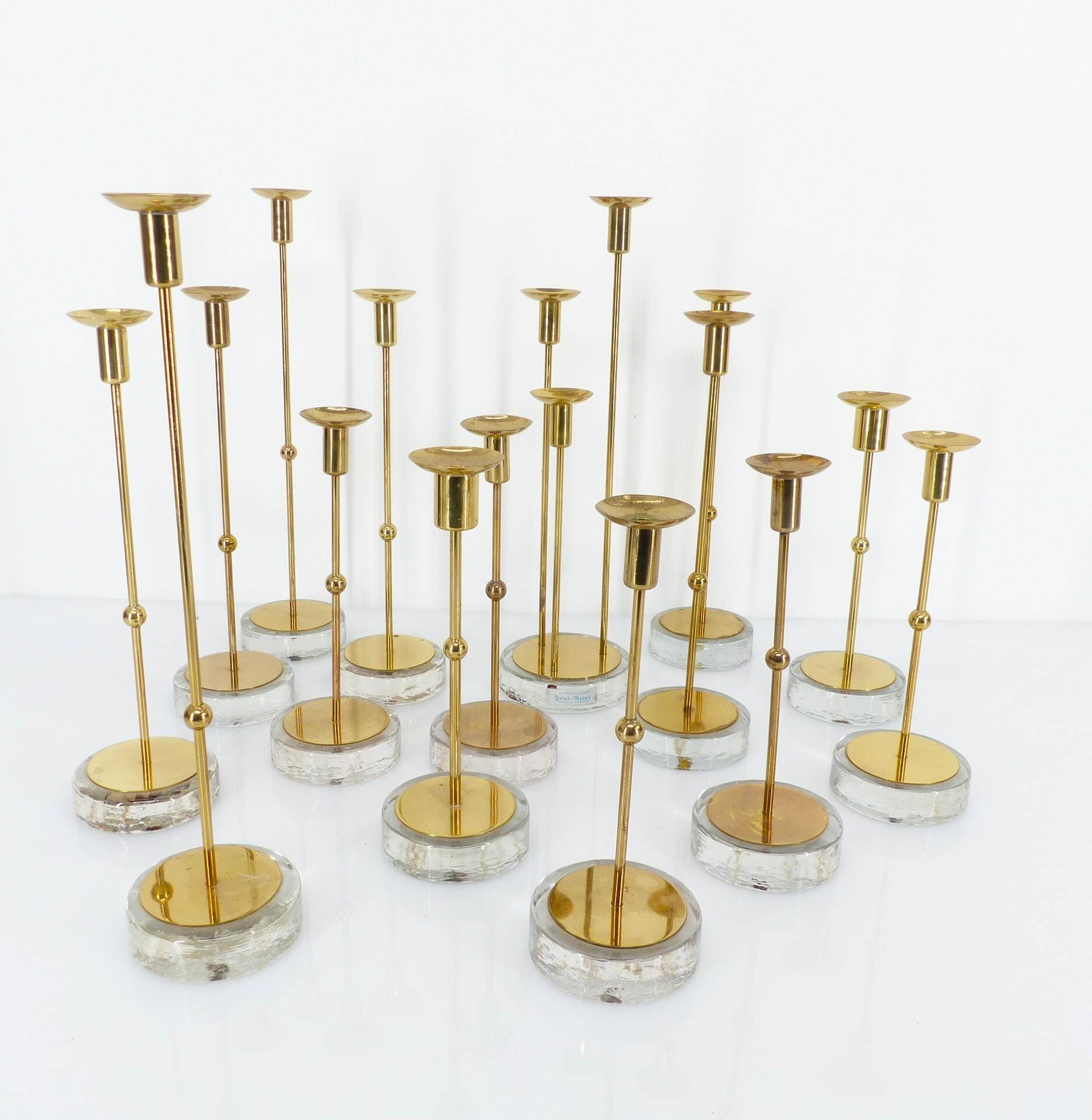 Set of 15 Scandinavian candle holders in brass and glass, Gunnar Ander, Ystad Met
