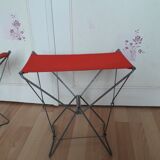 Folding stool in red canvas but unstitched on one side