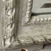 Large antique beveled mirror in carved wood painted with floral decoration and