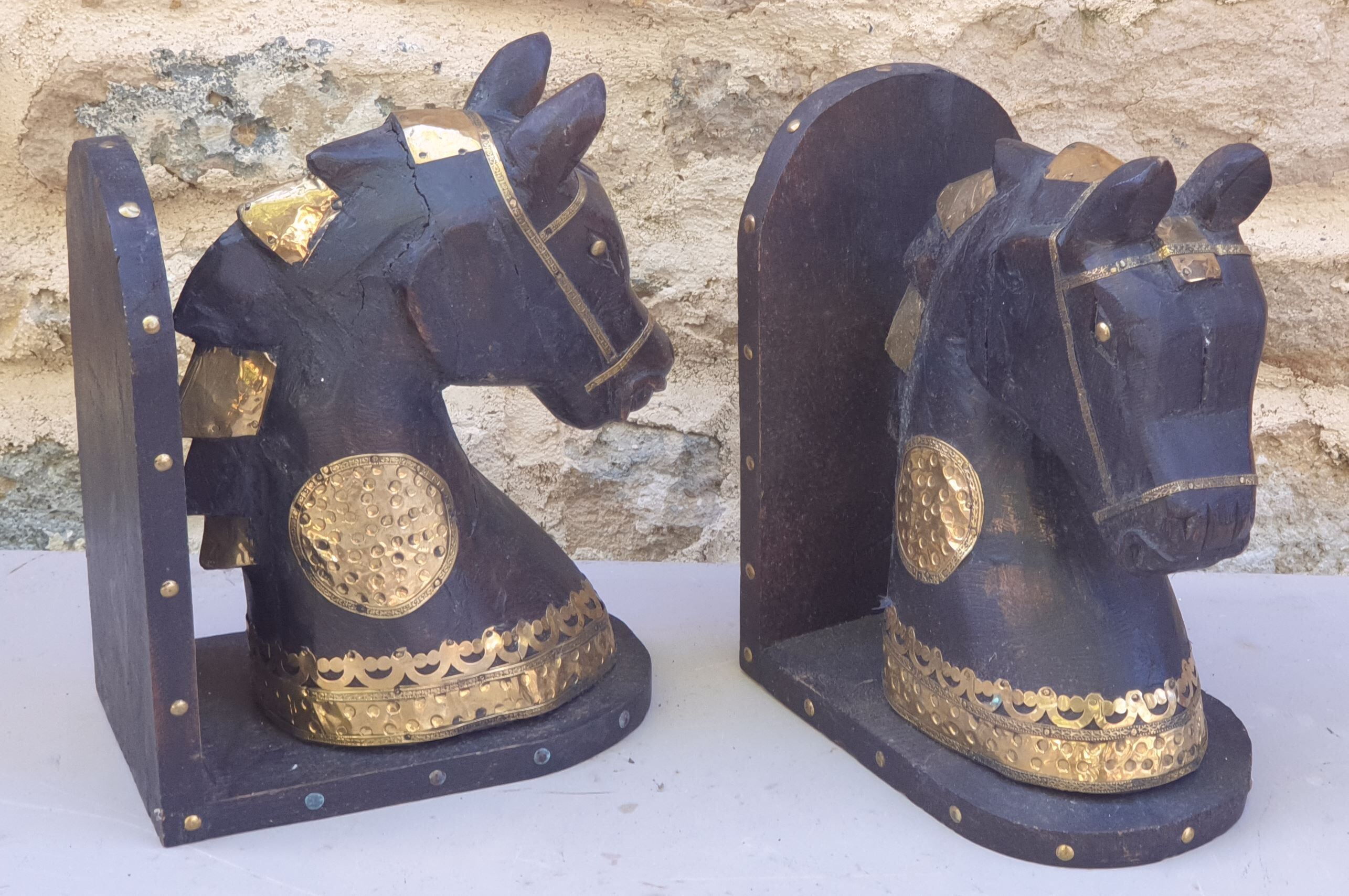 Horse bookbands in carved wood and brass
