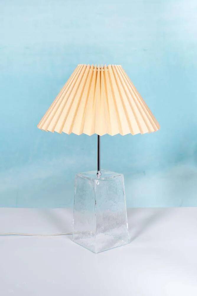 Minimalist glass table lamp from the 80s with a pleated shade.