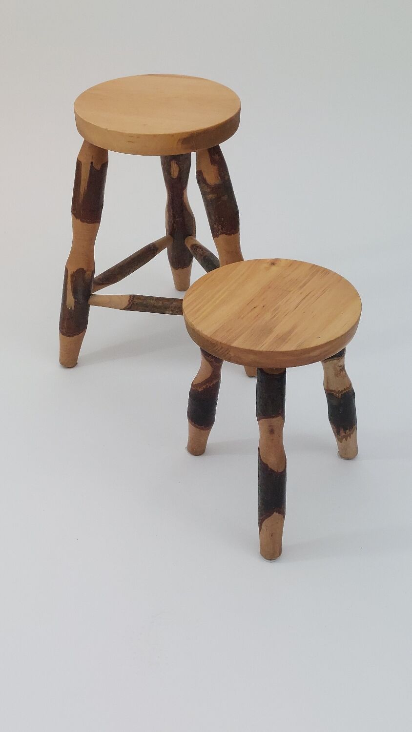 Pair of walnut stools sculpted in a vintage mid-century cross-section.