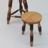 Pair of walnut stools sculpted in a vintage mid-century cross-section.