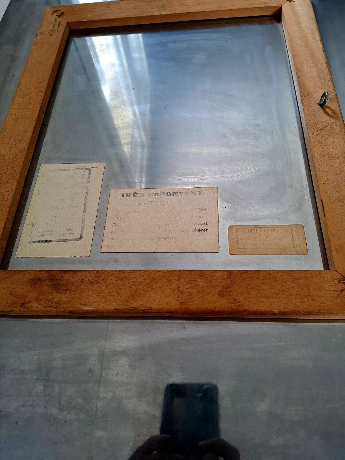 Silkscreen on brushed aluminium from the 1970s.