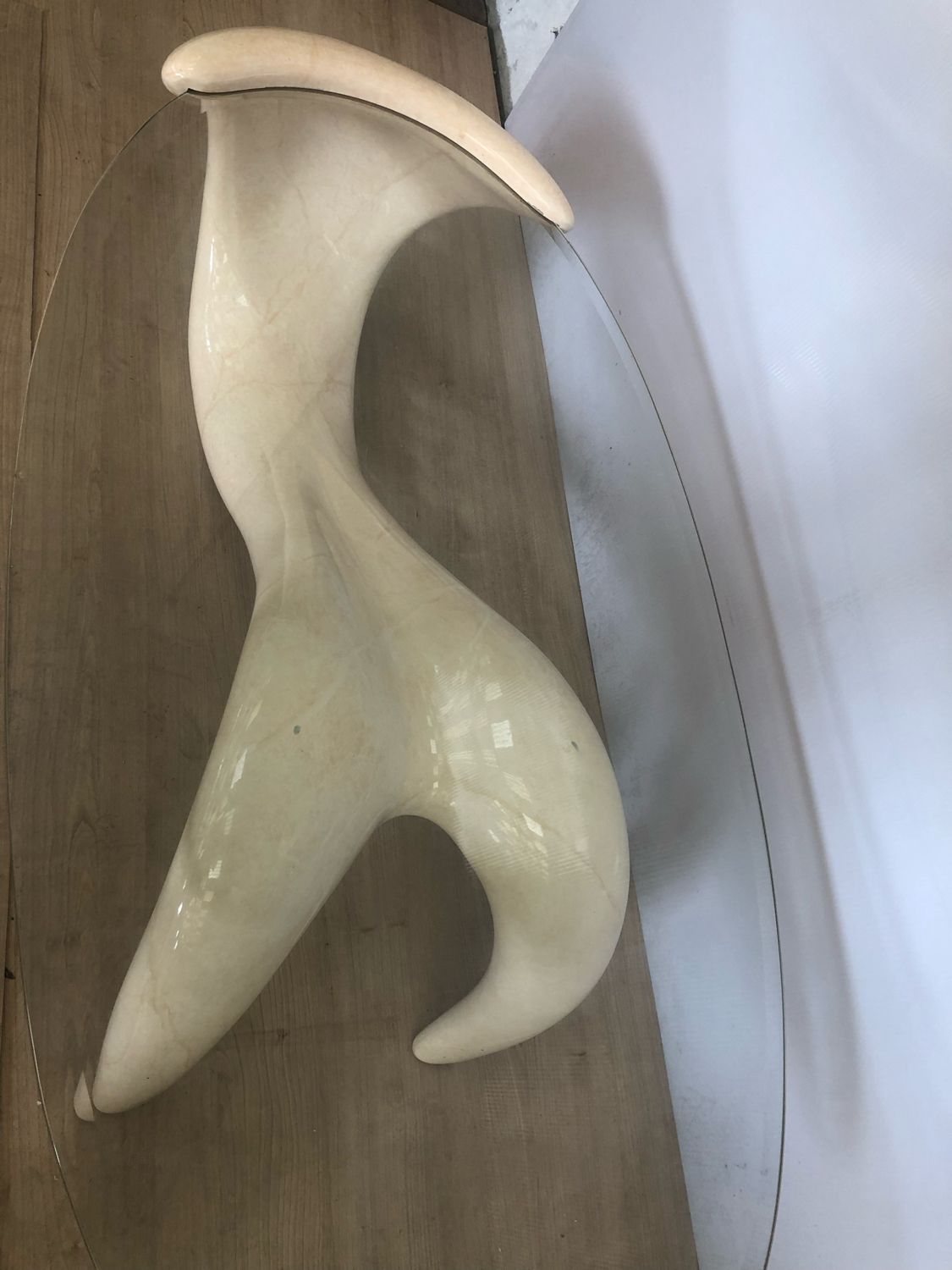 Abstract coffee table in the shape of a woman and marbled fiberglass