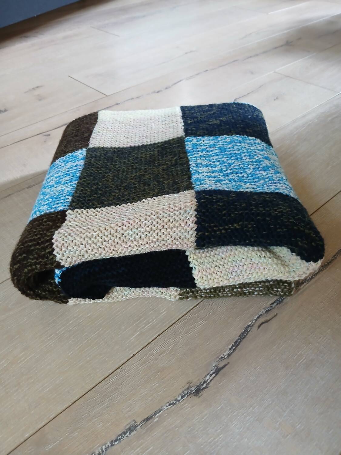 Hand knitted patchwork plaid