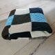 Hand knitted patchwork plaid