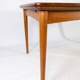 Dining table in teak with extentions and legs in oak, of danish design from the 1960s.