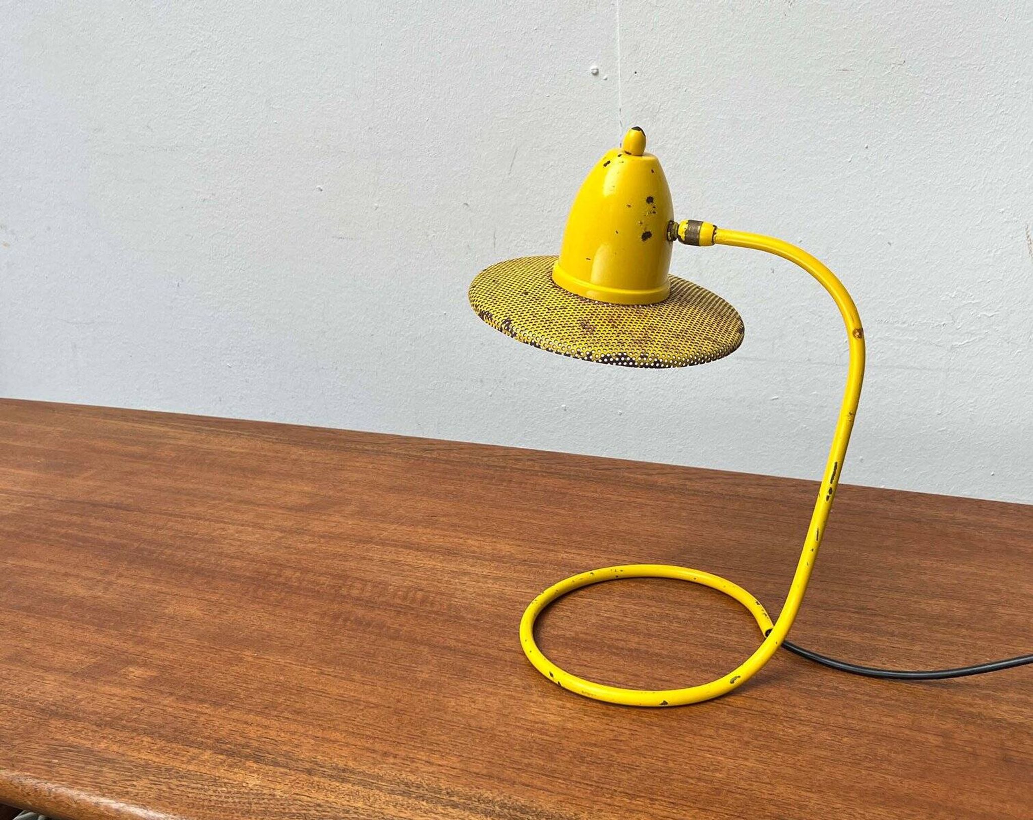 Perforated metal table lamp in Mid-Century Modern style, in the style of Mathieu Matégot, 1960s.