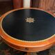 Circular table in solid mahogany and black leather claw base Restoration