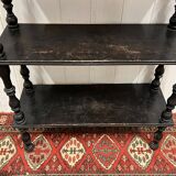 Blackened wooden shelf.