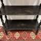 Blackened wooden shelf.