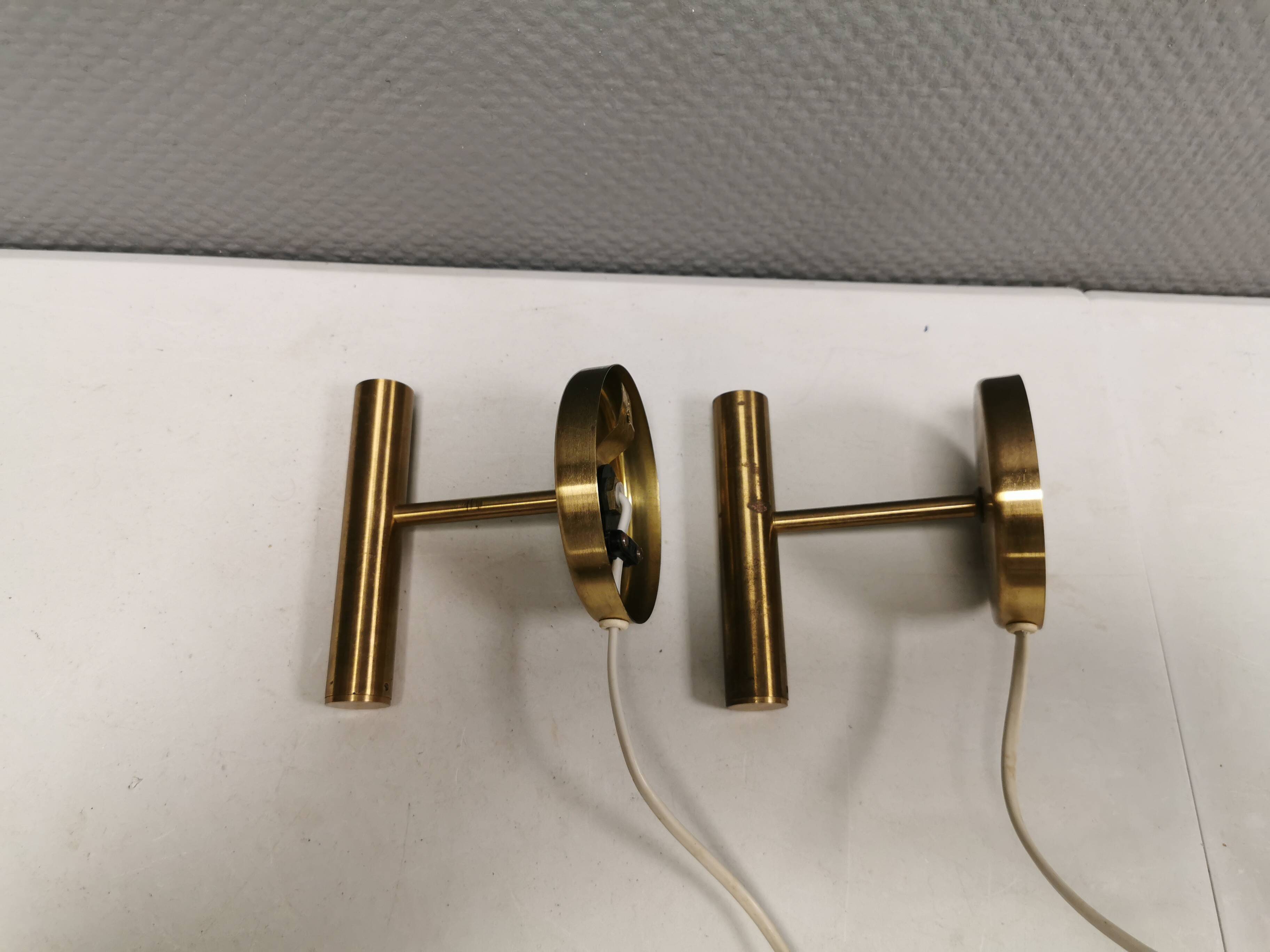 A set of stylish brass wall lamps from Danish Darø