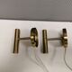 A set of stylish brass wall lamps from Danish Darø