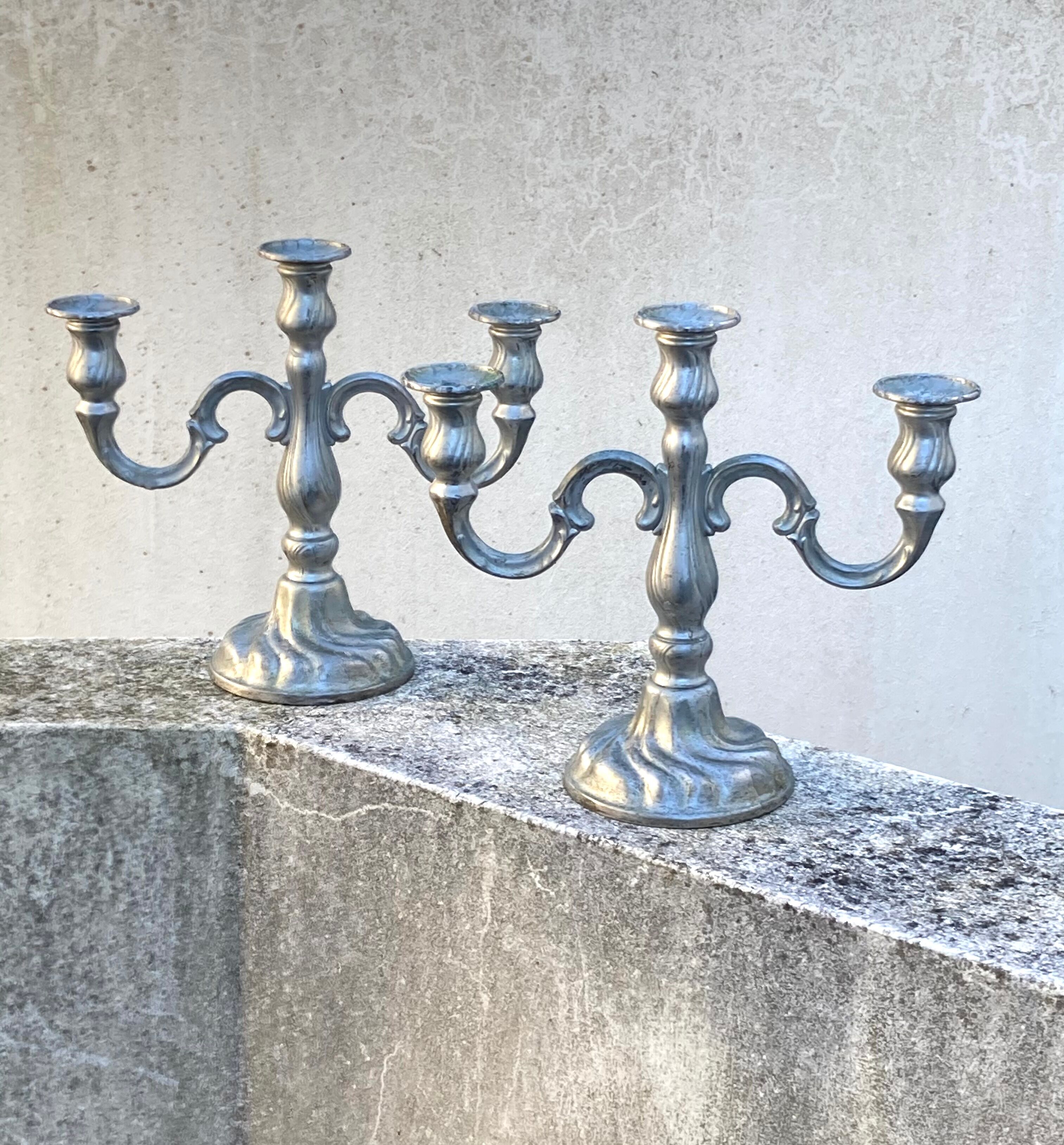 Set of two metal candlesticks