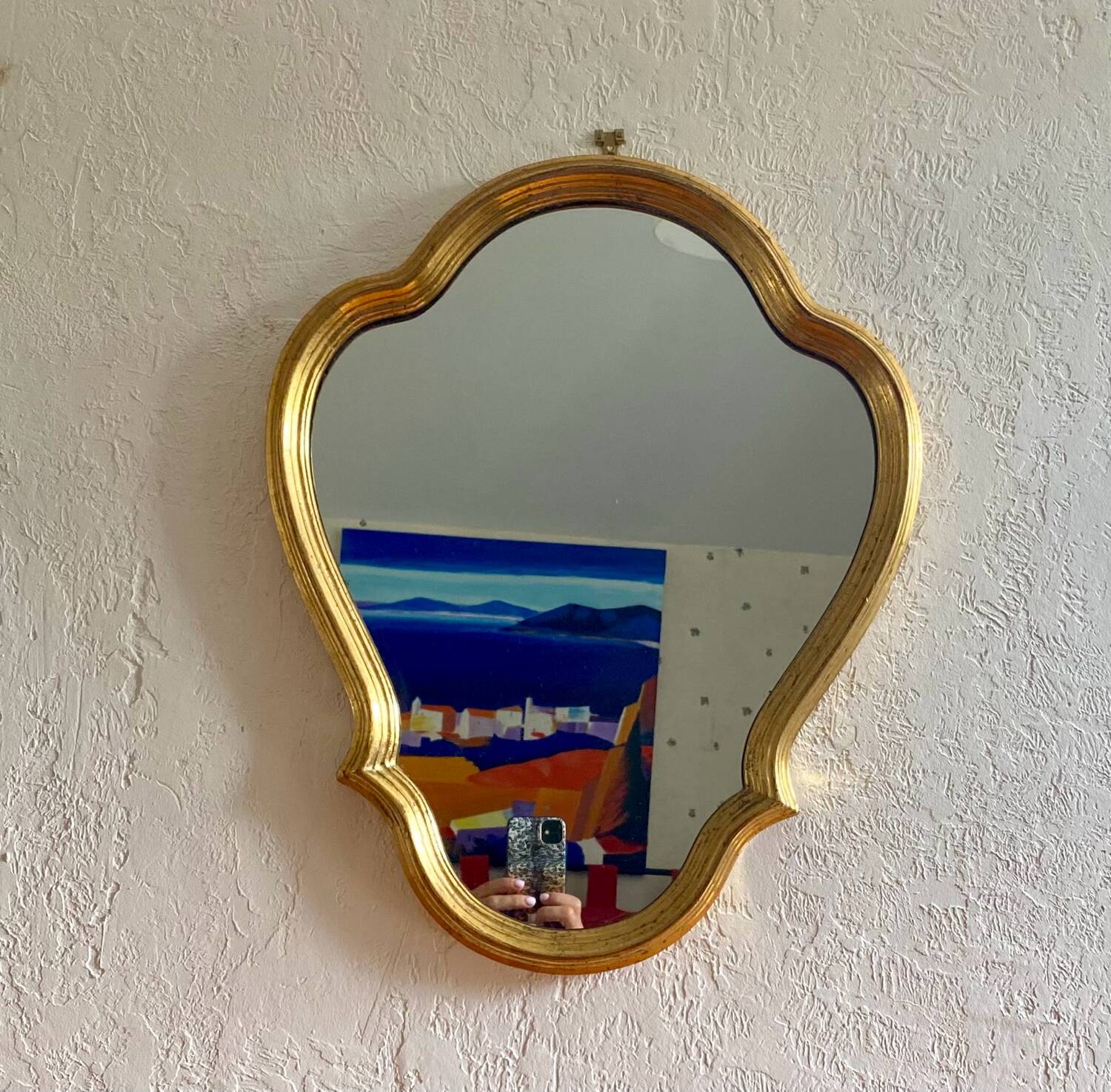 Wall mirror in a gilded wooden frame
