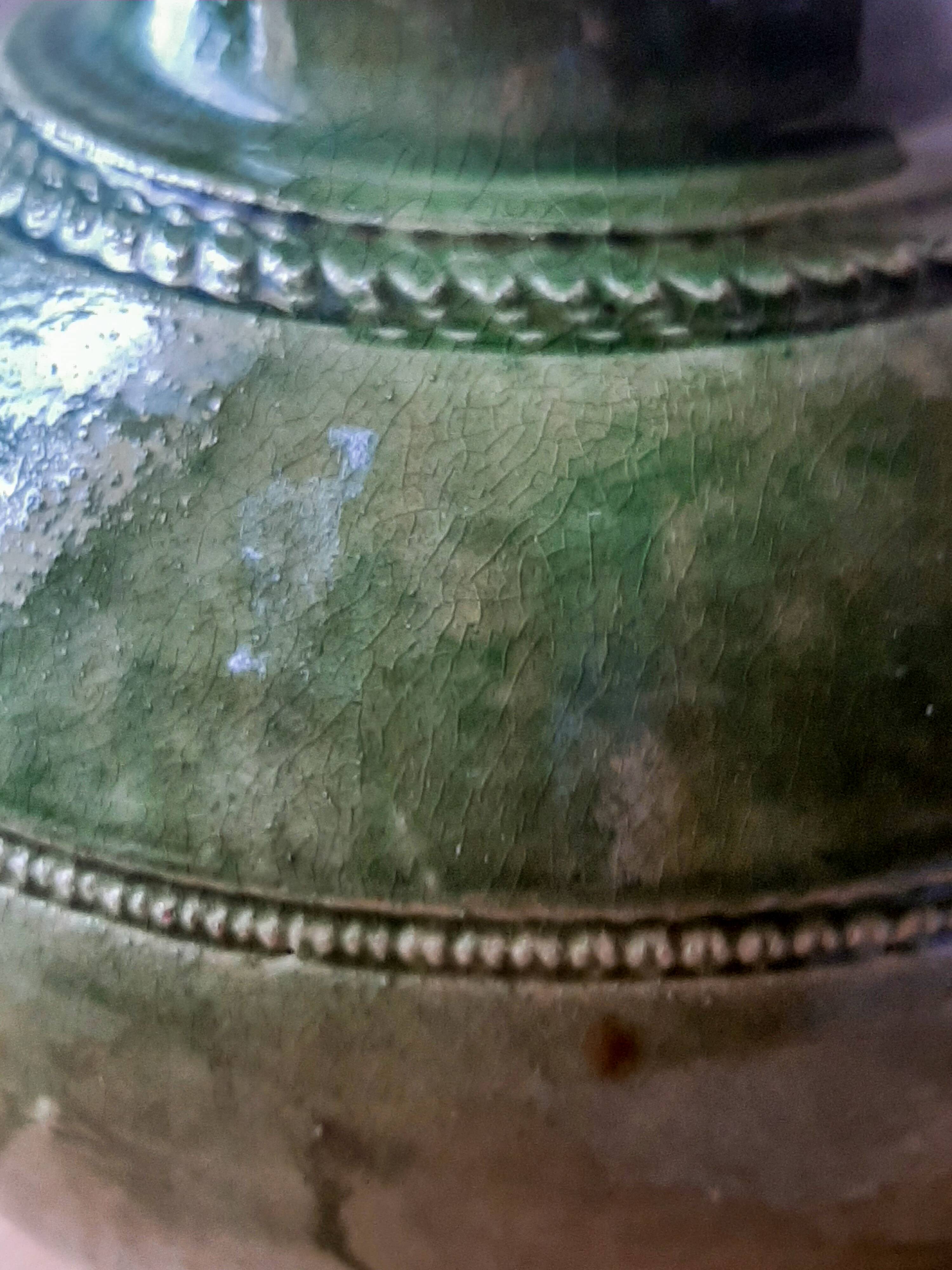 Ancient vase in glazed terracotta with green glaze.