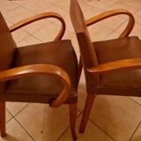 Pair of Art Deco armchairs in curved wood and brown leather – 1930s