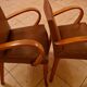 Pair of Art Deco armchairs in curved wood and brown leather – 1930s