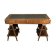 Walnut desk with green leather top resting on two trestles