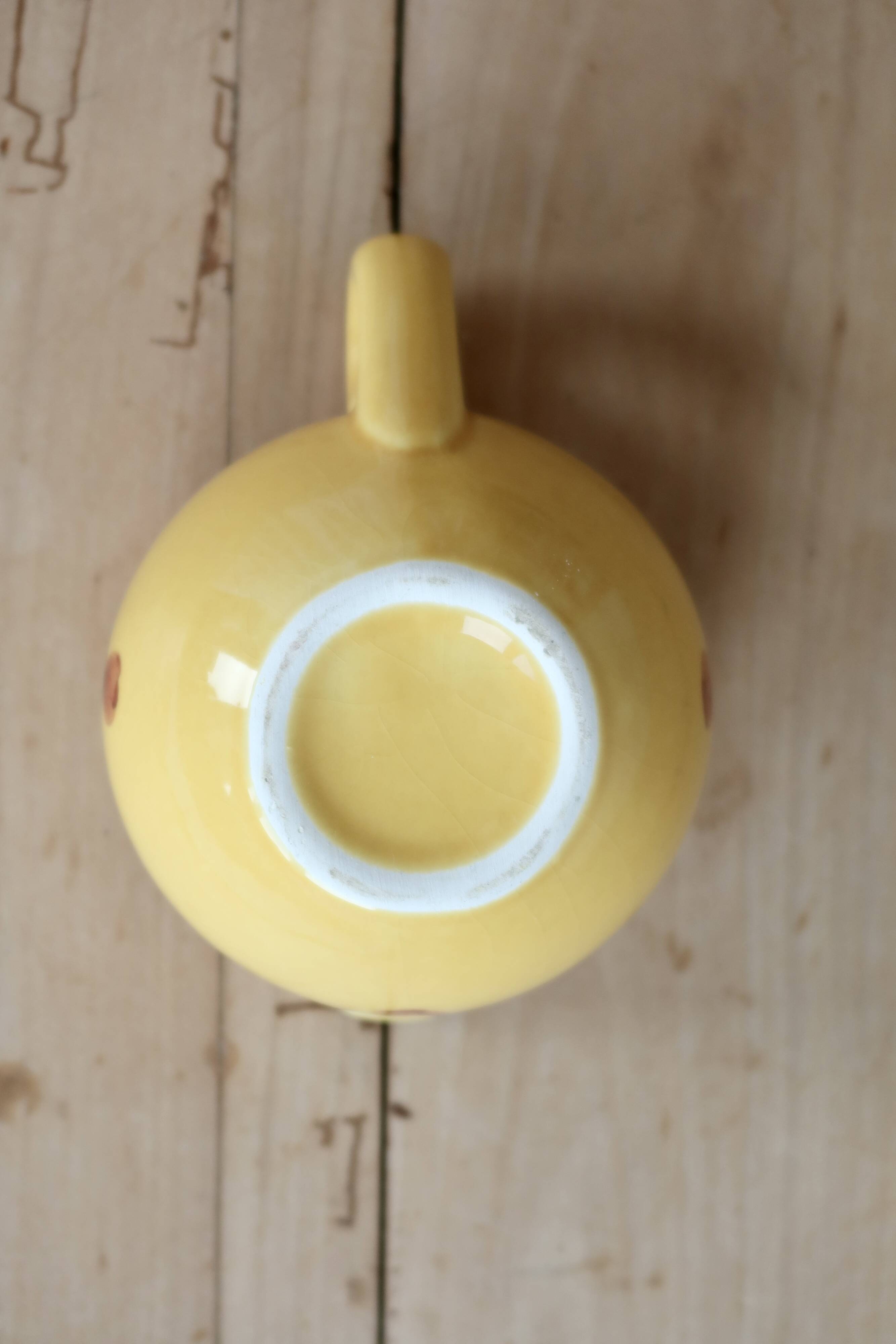 Vintage yellow ceramic milk jug