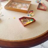 Mahogany game table and mahogany veneer, rolling half-moon console or round table.