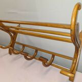 Coat rack with curved wooden hat holder