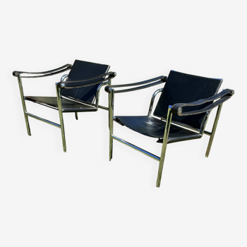 Pair of leather and steel armchairs