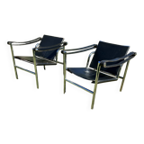 Paire de fauteuils en cuir et acier