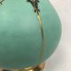 Ball vase with bent barrel in celadon green porcelain, nineteenth