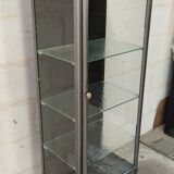 old medical display case with a graphite metal door