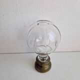 Glass and brass stair ball