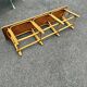 Vintage 1950s set: large table with tripod base and benches in woven chestnut