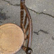 Vintage 19th-century bistro chair made of curved solid wood and caned in the Thonet style.