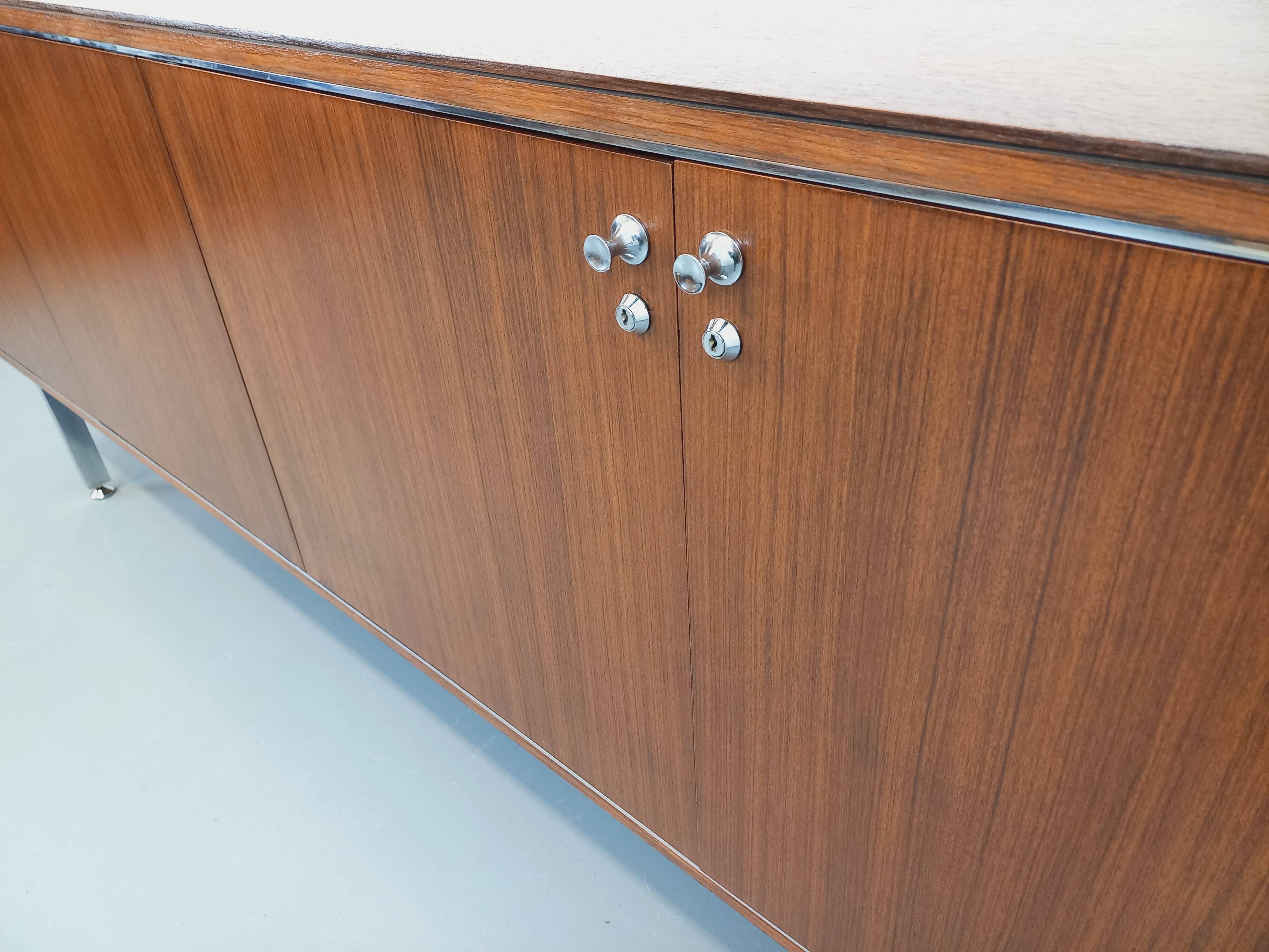 Vintage modernist enfilade in rosewood and chrome metal from the 60s and 70s.