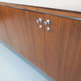 Vintage modernist enfilade in rosewood and chrome metal from the 60s and 70s.