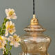 Vintage amber glass suspension globe