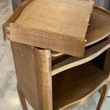 A bedside table with a drawer and a niche in Louis XV style.