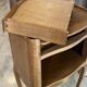 A bedside table with a drawer and a niche in Louis XV style.