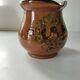 Glazed earthenware pitcher signed HR with a design of stylised birds.