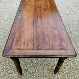 Old French farmhouse table in walnut with turned legs.