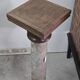 Column-shaped pedestal, made of solid wood and faux marble paint.