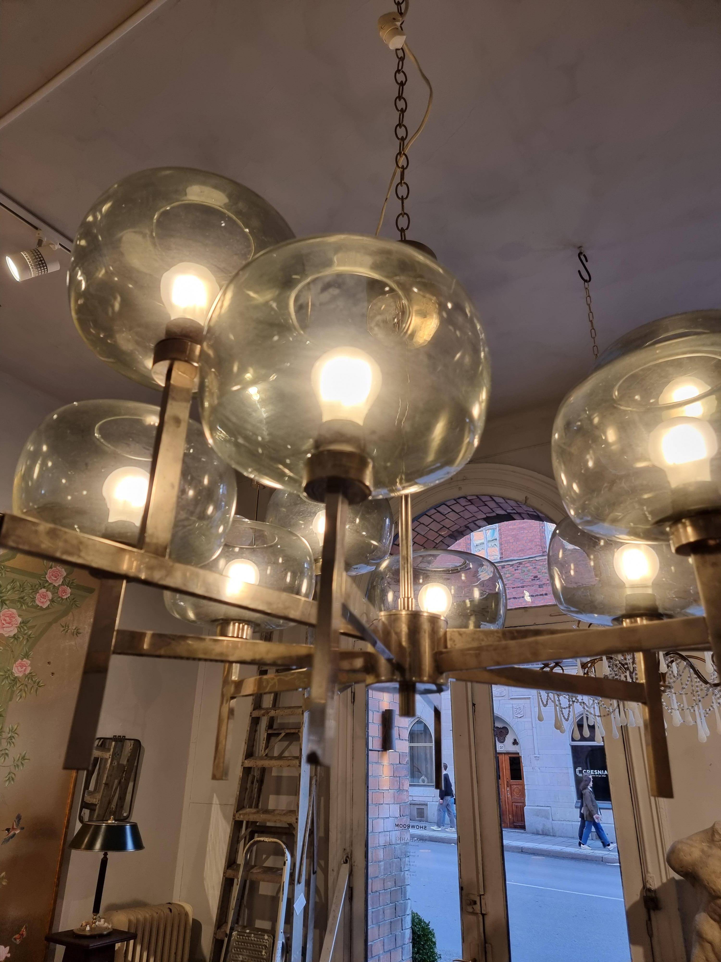 Timeless modern Scandinavian / mid-century chandelier in chrome and smoked glass.
