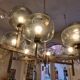 Timeless modern Scandinavian / mid-century chandelier in chrome and smoked glass.