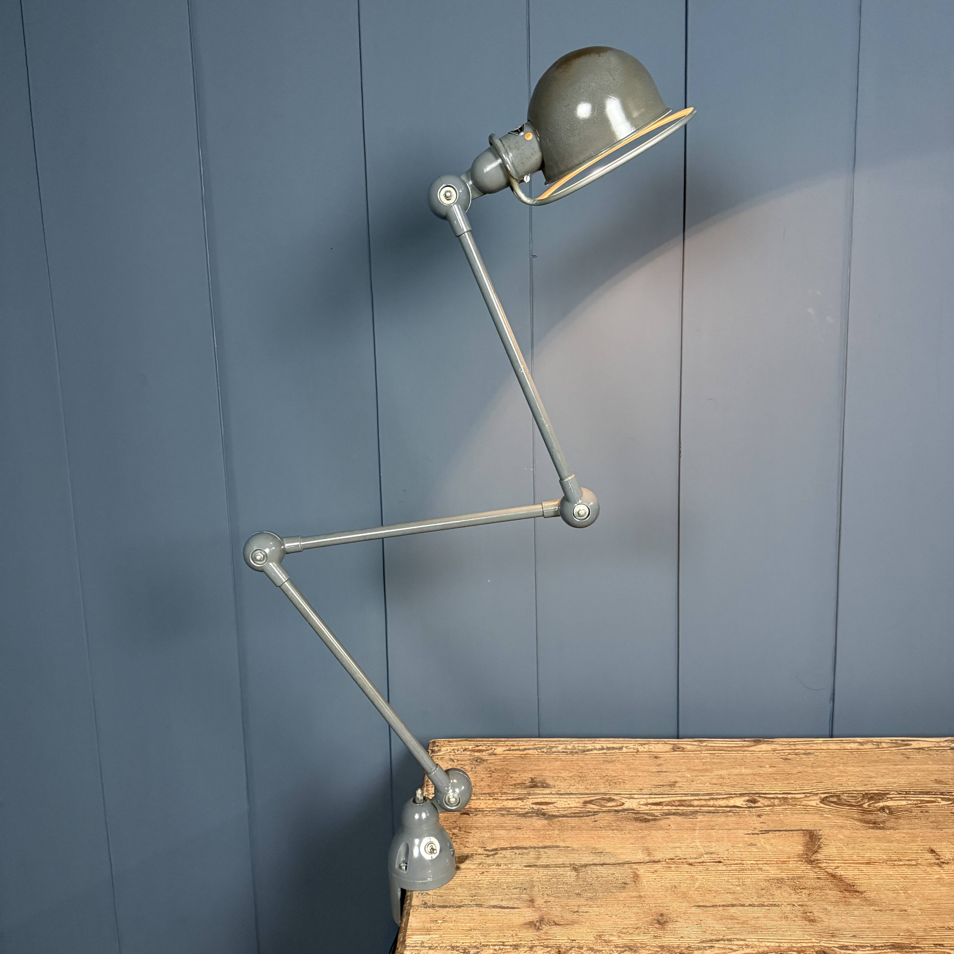 Dark grey Jielde three-arm clamp table lamp