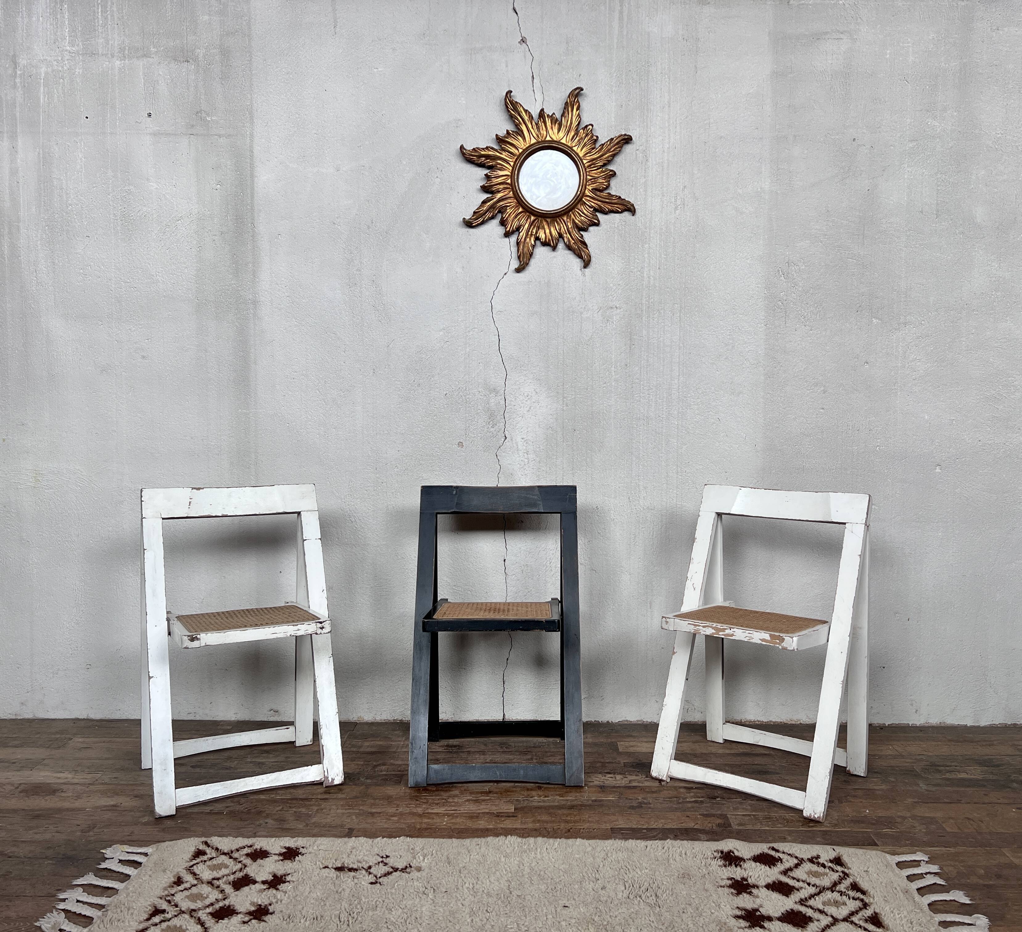 Trio of vintage folding chairs with canning and solid wood